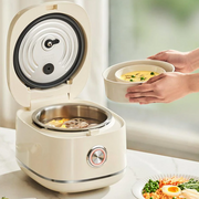 Top-down view of the Hoper Layer stainless steel rice cooker with its lid open, showing a steaming hot meal being served.
