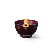The Ishida Corgi soup bowl and chopstick rest set, showing the dark 'Uchishu' bowl with a cute corgi rest perched playfully on the rim.