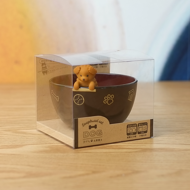 The Ishida Japanese soup bowl set, featuring a brown bowl and a cute, poodle-shaped chopstick rest that hangs on the rim.
