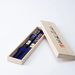 Ishida Wakasa Nuri lacquered chopsticks set displayed in an elegant wooden gift box with indigo fabric lining, showcasing two pairs of chopsticks.