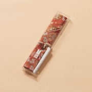 The Kyoto Nishijin Chopstick Pouch, showing the intricate "Spring Flower Basket" woven pattern on a fabric background.