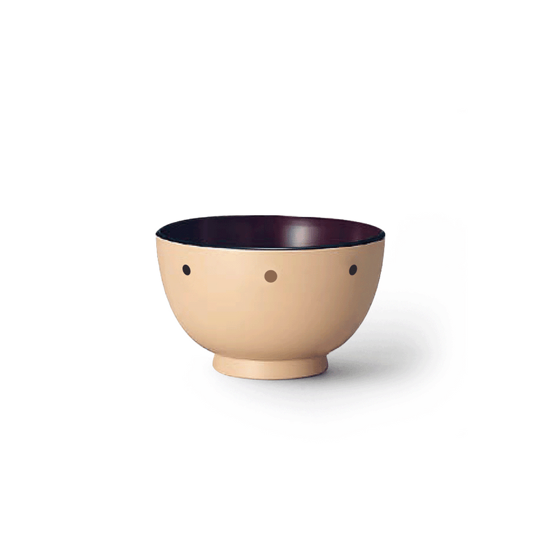 The Ishida Dotted Pattern Japanese Soup Bowl, showing its beige exterior with small dark dots and a contrasting dark interior.