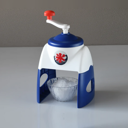 Japanese kakigori manual ice shaver in blue and white with red crank handle and traditional ice flag emblem, shaving fluffy ice into a glass bowl
