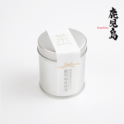 A silver tin of Kagoshima Premium Matcha with a white label showing the word 'MATCHA' and Japanese calligraphy for Kagoshima.
