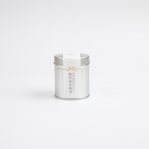 A silver tin of Kagoshima Premium Matcha Powder, shown from the front with its white label and traditional Japanese text.