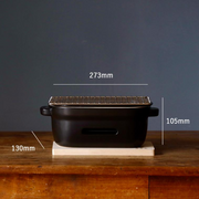 A side view of the Kamoshika Douguten konro grill on its wooden base, with dimension lines showing a length of 273mm, width of 130mm, and height of 105mm.


