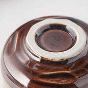Underside of the Keisai Miyajima matcha bowl showing the foot ring and maker's mark