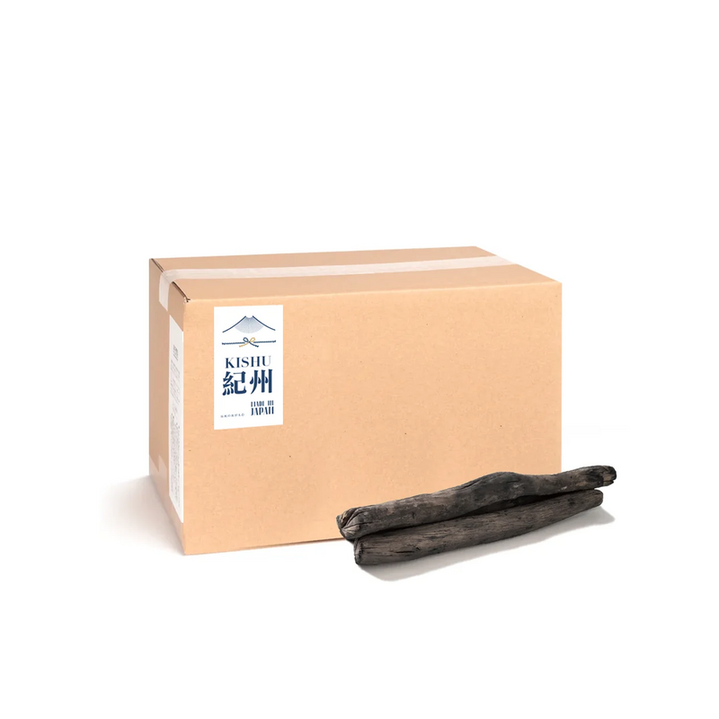 A product image of the 2KG box of Premium Kishu Binchotan, with several pieces of the authentic Japanese white charcoal displayed in front.

