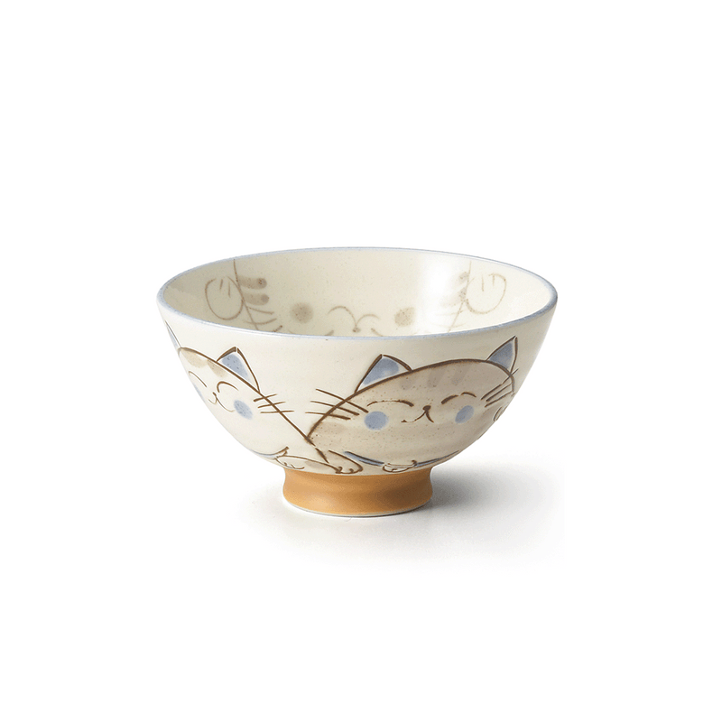 A side view of the Ko-dehiki Japanese Neko Cat Bowl, showing its beige powdered finish, charming cat face illustrations, and unglazed brown footed base.