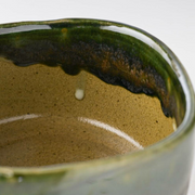Interior view of the Kochidori Matcha Bowl highlighting the glossy green Oribe glaze with organic drip patterns.
