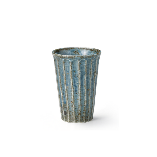 A textured blue ceramic cup with vertical ridges and a speckled glaze. The cup's rustic aesthetic is highlighted by its varied blue tones and weathered rim, presenting a sturdy yet elegant appearance.