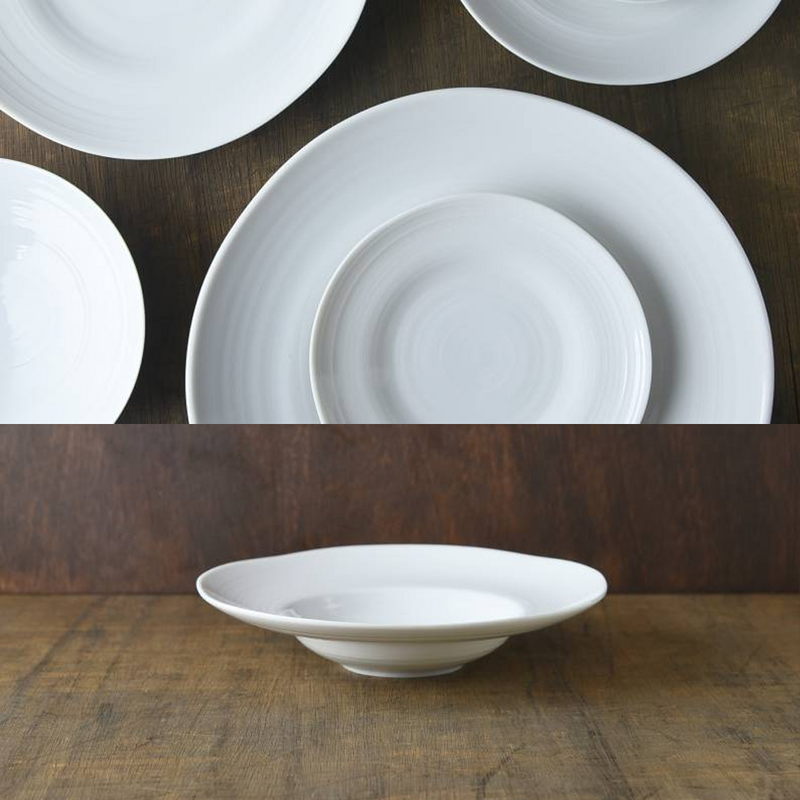 A collage showing the Kushime Dinner Hat Plate from a side profile and arranged with other plates from the same series on a dark wood background.
