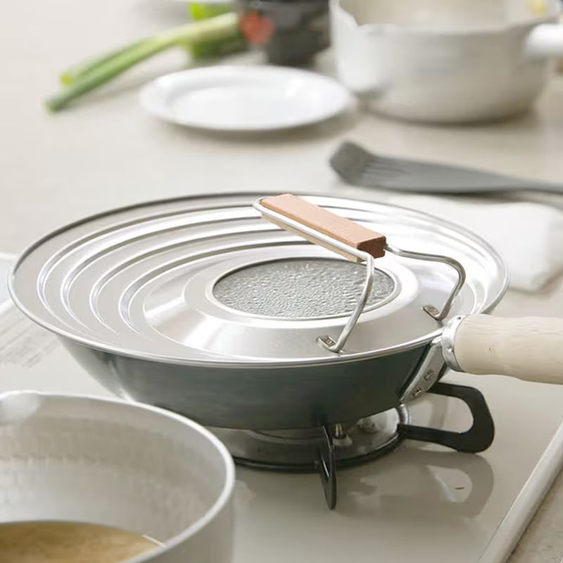 Kyoto Katsugu multi-size lid sitting on a frypan during cooking