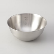 A close-up of the LaLa Shine stainless steel bowl's interior, showing the convenient measurement markings.

