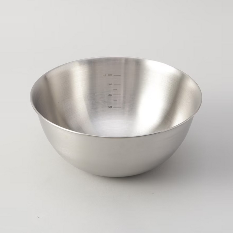 A close-up of the LaLa Shine stainless steel bowl's interior, showing the convenient measurement markings.

