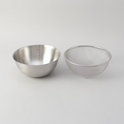 The LaLa Shine stainless steel mixing bowl and matching mesh strainer shown side-by-side.

