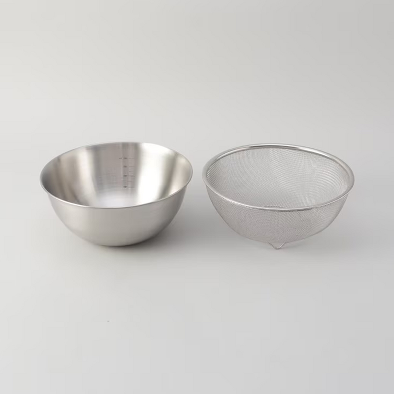 The LaLa Shine stainless steel mixing bowl and matching mesh strainer shown side-by-side.

