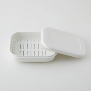 A single white Marna Kiwami Freeze & Microwave Rice Container with its lid propped open on a white background.
