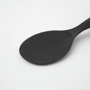 Close-up of the textured paddle surface on a Marna Premium Standing Rice Scoop in black


