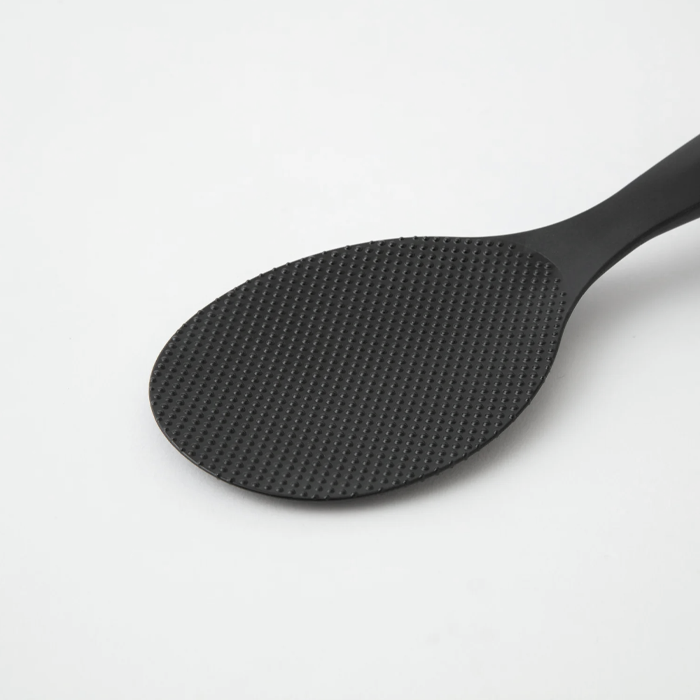 Close-up of the textured paddle surface on a Marna Premium Standing Rice Scoop in black

