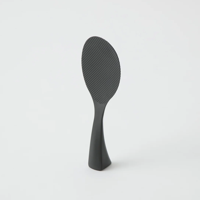 Marna Premium Standing Rice Scoop in black standing upright on its integrated base, highlighting slim profile









