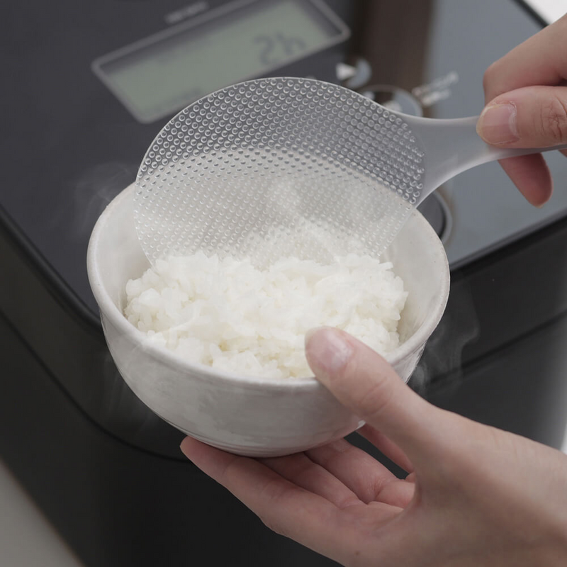 Full view of the Marna Premium TPX Standing Rice Scoop standing upright.