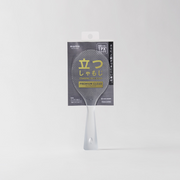 The award-winning Marna Premium TPX Standing Rice Scoop, a translucent frosted rice paddle, shown in its official Japanese retail packaging.
