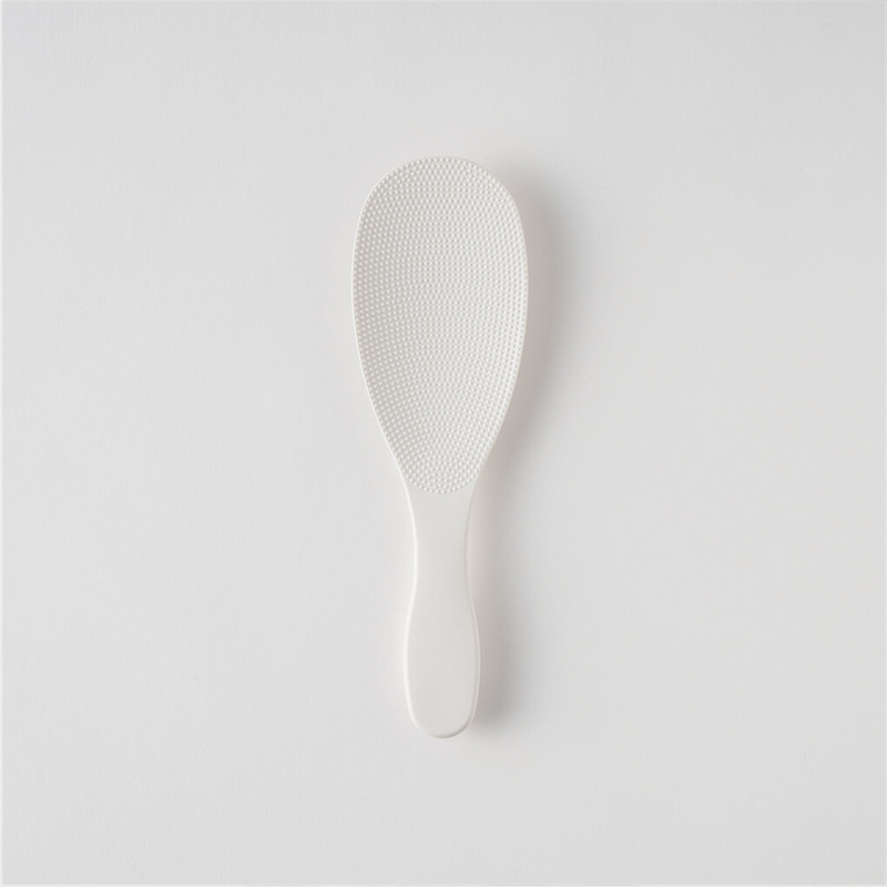 The award-winning Marna Premium TPX Standing Rice Scoop, a translucent frosted rice paddle, shown in its official Japanese retail packaging.