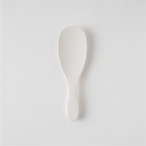 The award-winning Marna Premium TPX Standing Rice Scoop, a translucent frosted rice paddle, shown in its official Japanese retail packaging.