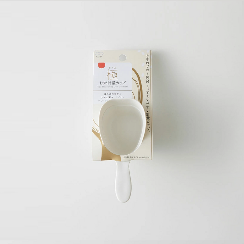 The Marna 'Kiwami' Ultimate Rice Measuring Scoop, a white, long-handled cup, shown in its official Japanese retail packaging.
