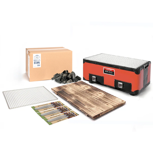 Mikawa Konro Grill Starter Set featuring a 38cm red rectangular grill, wooden base, stainless steel skewers, and a 2kg bag of Miyazaki Hyuga Binchotan charcoal.