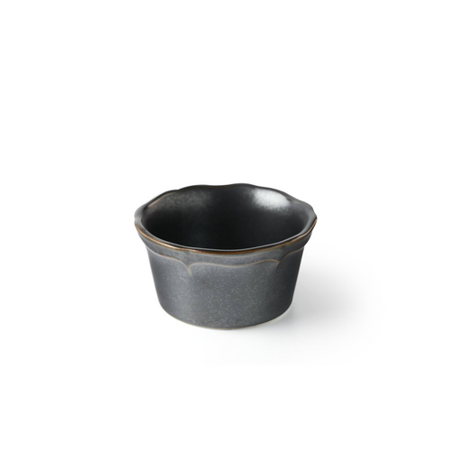 A dark grey ceramic mini bowl with a rustic gold rim, showing a subtle petal-shaped design, against a white background.