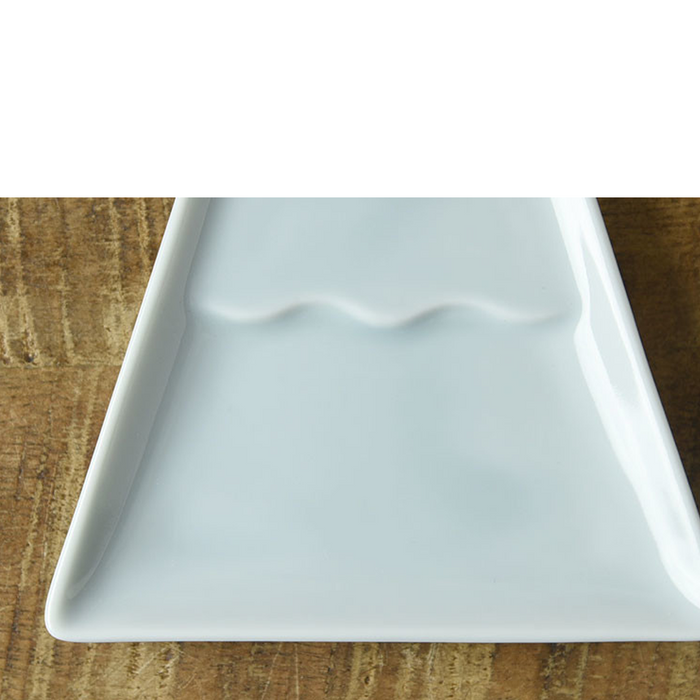 Close-up of the Mino Yaki Mount Fuji Soy Sauce Plate highlighting the smooth, light blue ceramic surface and the raised ridge representing Mount Fuji’s peak.