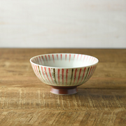 Mino Yaki Tokusa Rice Bowl in Red, featuring traditional vertical brushstroke stripes on a white ceramic base with a reddish-brown foot.