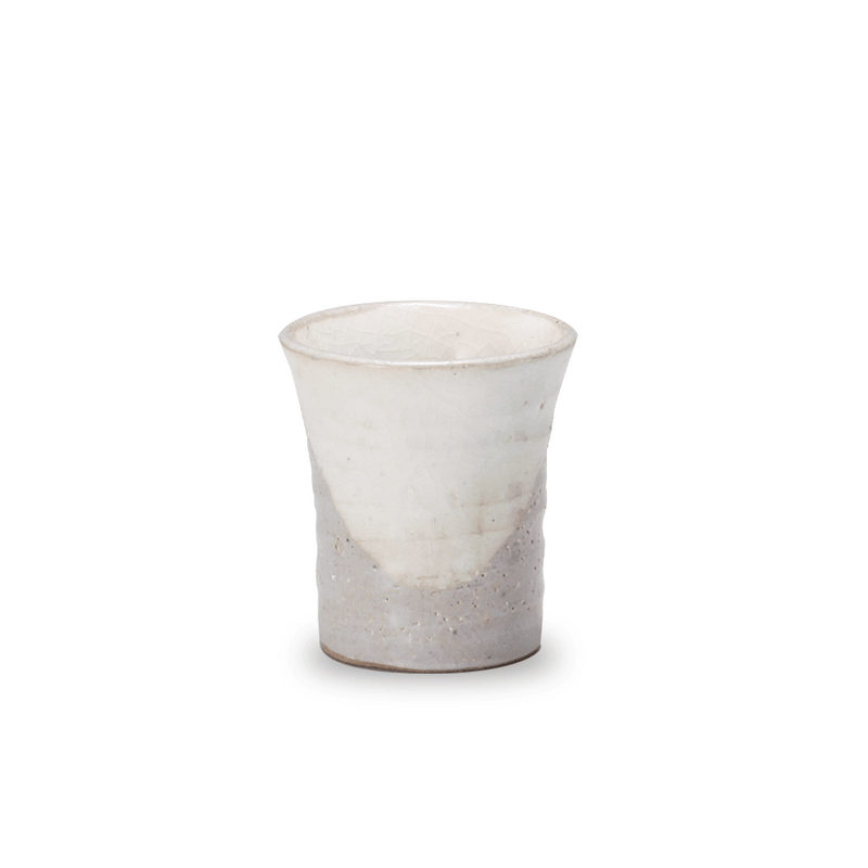 The Mino Yaki Hagi Teacup, showing its rustic two-tone finish with a white crackle glaze top and a rough, unglazed earthenware base.