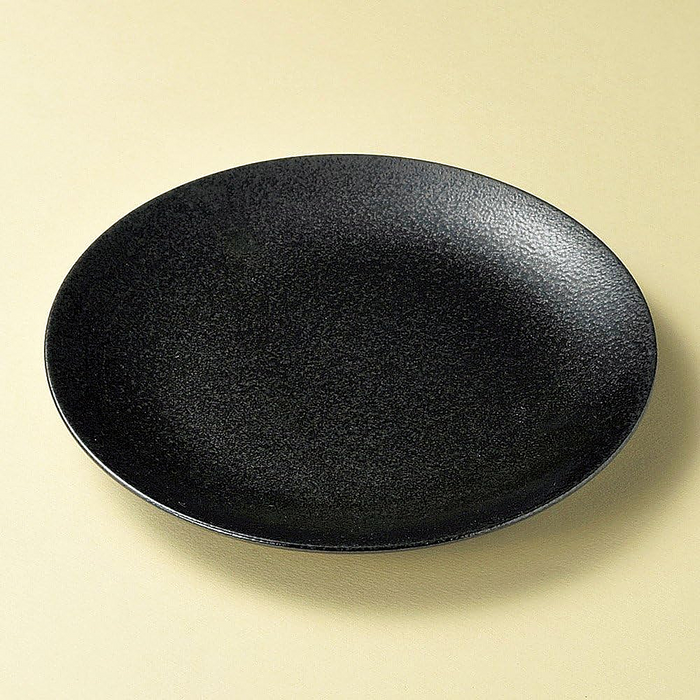 Japanese-crafted matte black dinner plate showcasing fine Mino Yaki craftsmanship.