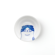 A top-down view of the Shichita Mino Yaki Cat Scottish side plate, showing the endearing cat illustration with folded ears on a white porcelain surface.