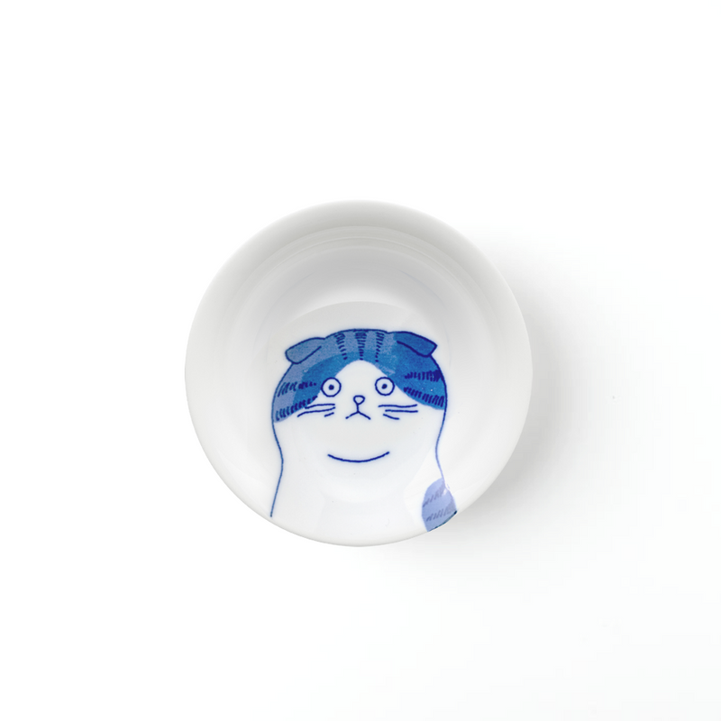 A top-down view of the Shichita Mino Yaki Cat Scottish side plate, showing the endearing cat illustration with folded ears on a white porcelain surface.