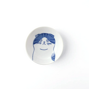 A studio photo of the Shichita Mino Yaki Cat Scottish Side Bowl, showing the blue and white illustration of a Scottish Fold cat's face from a top-down perspective.
