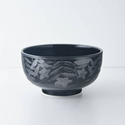 Close-up of the Mitsuhide Akechi Kikyo Bowl showing the detailed, embossed Kikyo floral pattern in a dark ink glaze.