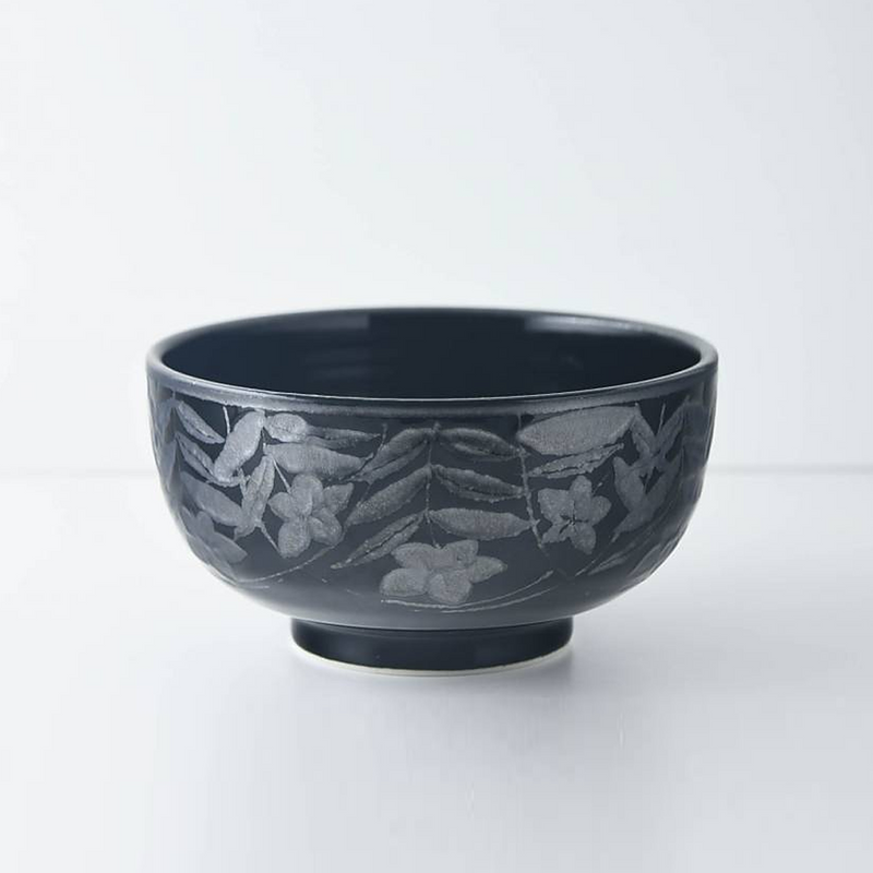Close-up of the Mitsuhide Akechi Kikyo Bowl showing the detailed, embossed Kikyo floral pattern in a dark ink glaze.