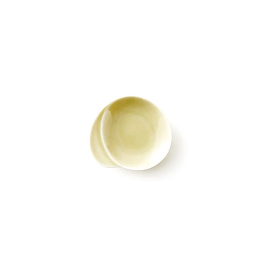 Miyama Gaku mini plate in warm pale yellow glaze with an organic asymmetric form featuring an integrated chopstick rest indent, shown against a white background