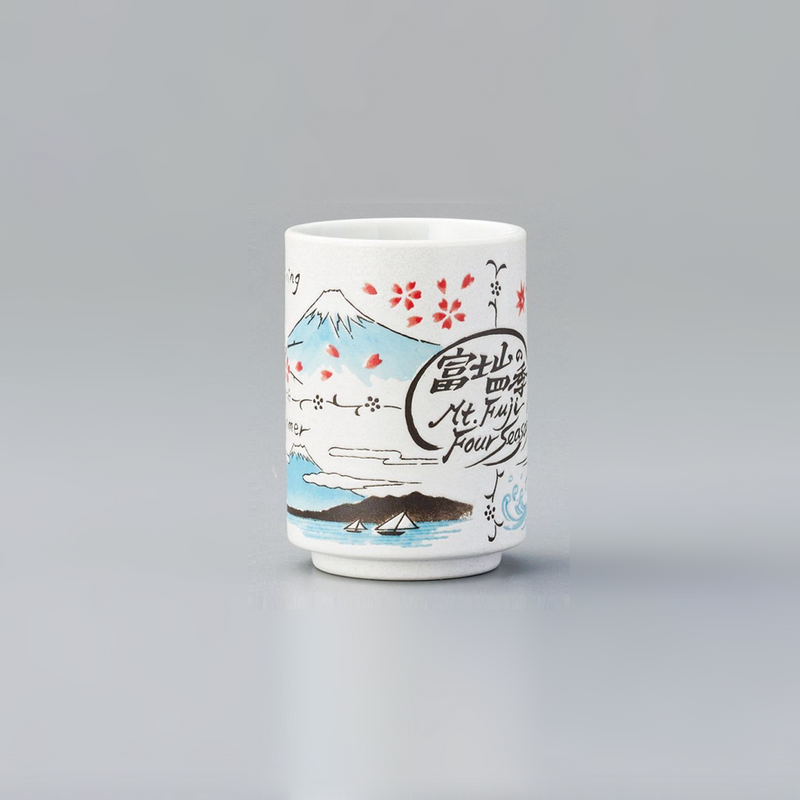 A cylindrical Japanese sushi teacup (yunomi) featuring illustrations of Mount Fuji across four seasons with cherry blossoms and Japanese calligraphy.