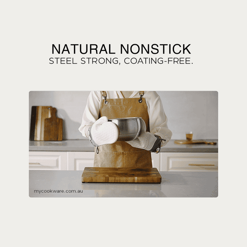 Advertisement showing a person in an apron holding a stainless steel pot with Natural Nonstick, Steel Strong, Coating-Free text.
