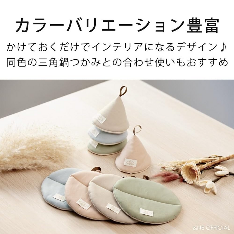 Set of triangular fabric coasters on a wooden surface with text above.