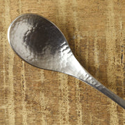 Close-up of the hammered bowl of the Nagomi stainless steel coffee spoon