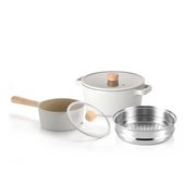 The Neoflam Fika 5-piece cookware set, showing the saucepan and pot in a light cream colour with wooden handles and glass lids, plus a compatible steamer insert.