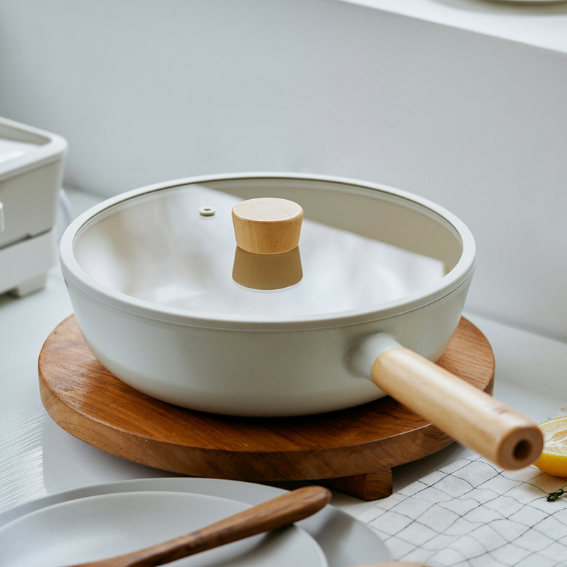 Neoflam Fika 30cm ceramic nonstick wok set, including the wok and a matching glass lid with a wooden handle, shown on a clean white background.