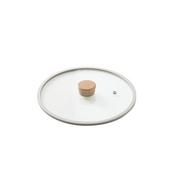 Neoflam Fika glass lid with a light-coloured silicone rim and a wooden knob, shown on a clean white background.
