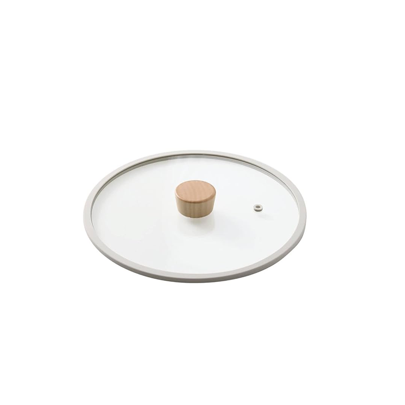 Neoflam Fika glass lid with a light-coloured silicone rim and a wooden knob, shown on a clean white background.
